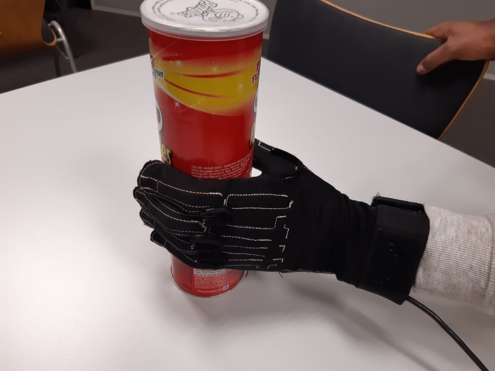 Cyberglove being used in combination with the pringles box to incorporate haptic feedback for testing purposes